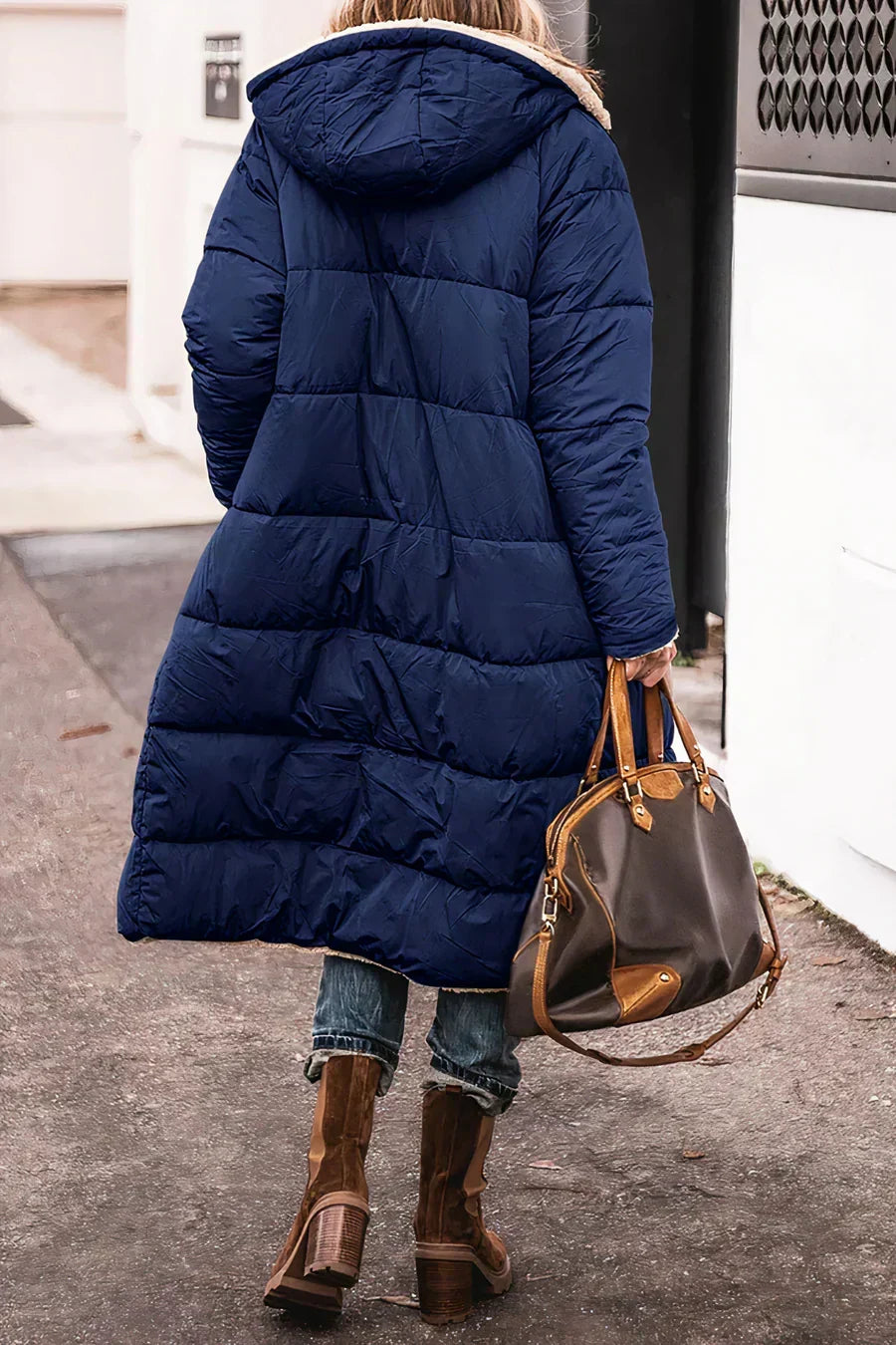Theodora outerwear featuring a versatile design for changing winter looks - blue back view