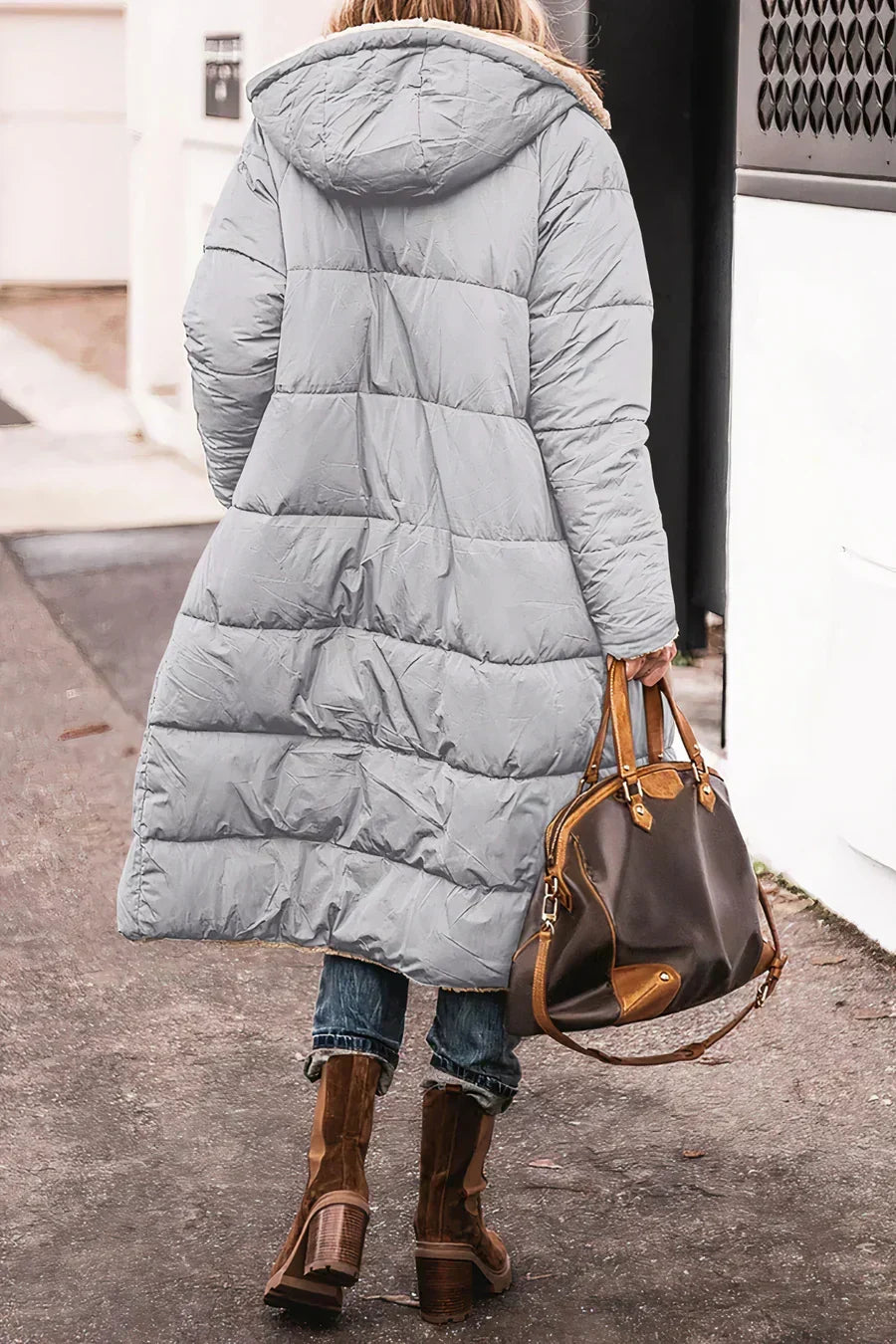 Comfortable women's winter coat combining warmth with practical reversibility